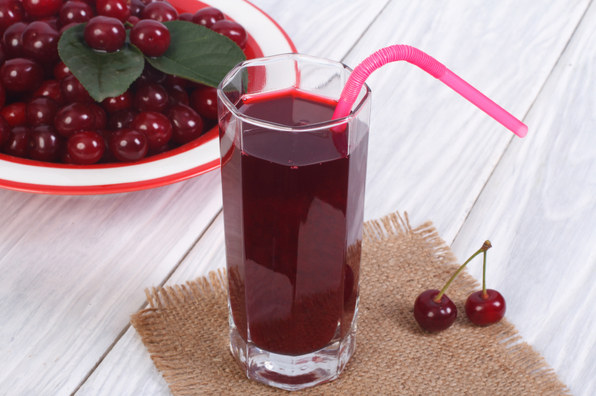 glass-cherry-juice-and-plenty-ripe-cherries-on-the-table.jpg